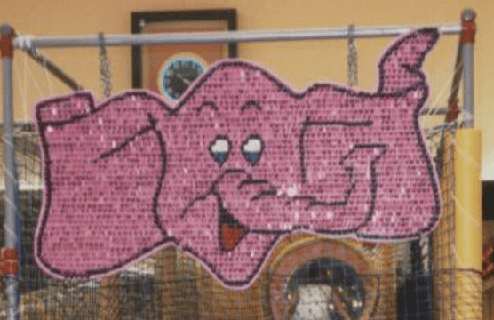 Pink sequined elephant wall hanging.