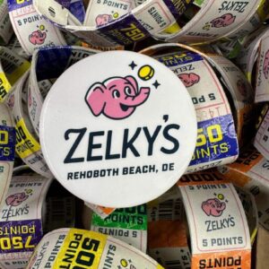 A pile of 5 0 point snacks with the logo for zelky 's.